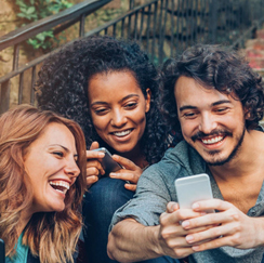 Group of people laughing with phone