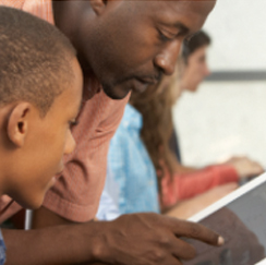 Teacher with tablet with children