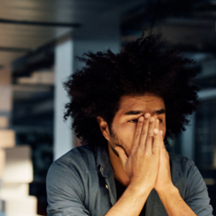 Man covering nose