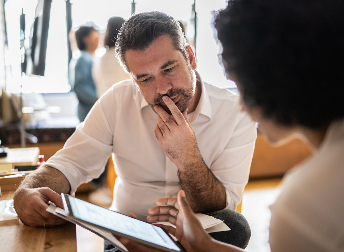 Man and woman looking at tablet