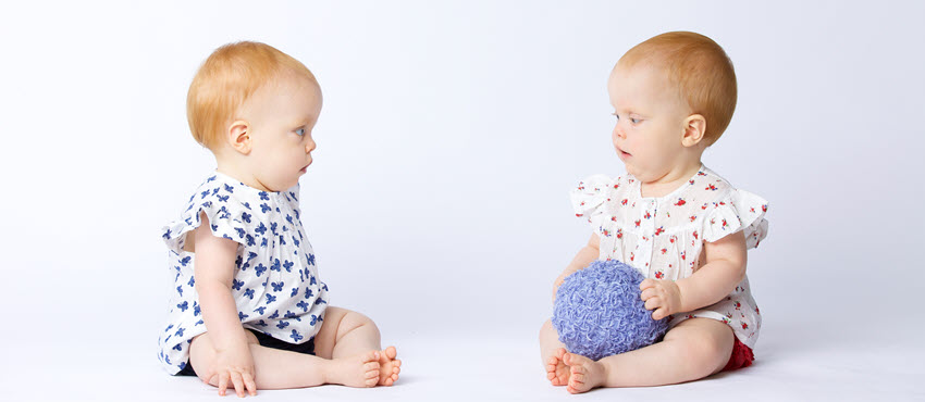 Image of babies with purple ball