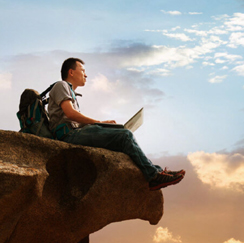 Man sitting on cliff