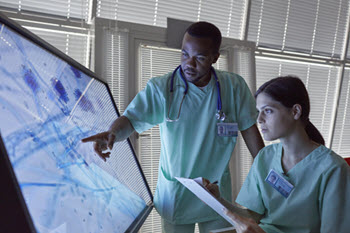 Healthcare professionals viewing screen
