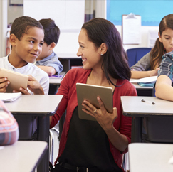 Teacher with tablet with kids