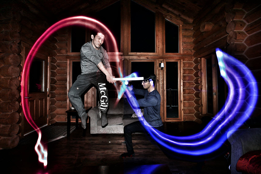 Two men with red and blue light swords