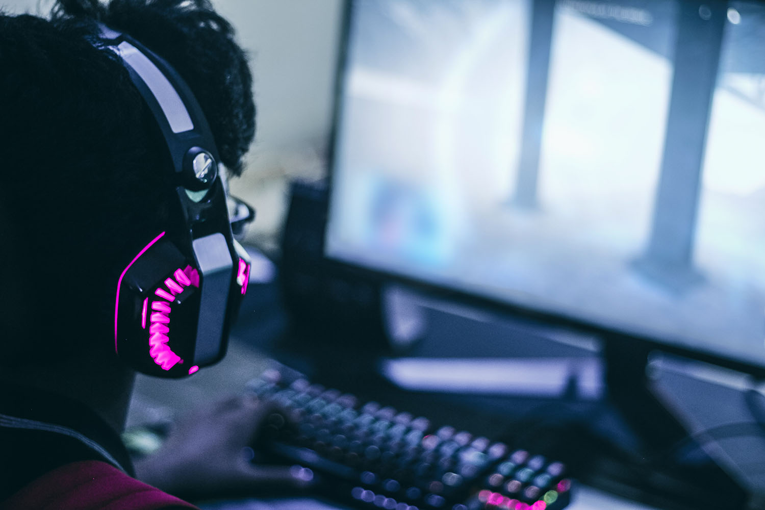 Desktop gamer with headphones