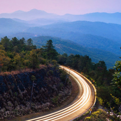 Country highway with streaks of white light