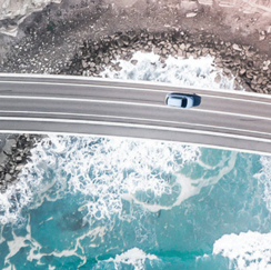 Car on highway bridge crossing