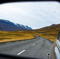 View of road through rear-view mirror
