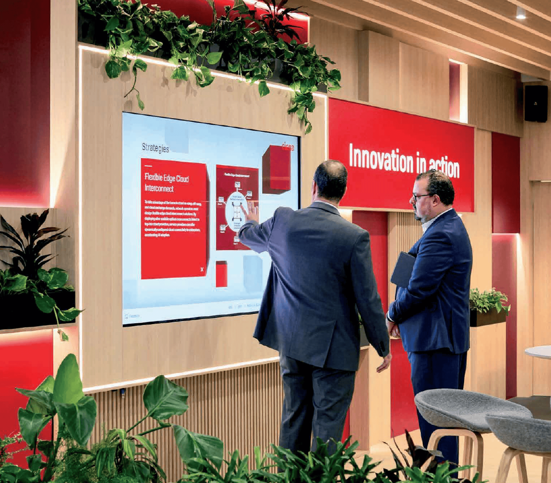 men talking in front of a screen