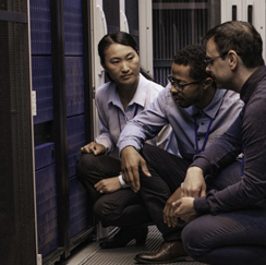 Group of people kneeling at servers