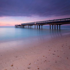 Beach and boardwalk at sunset