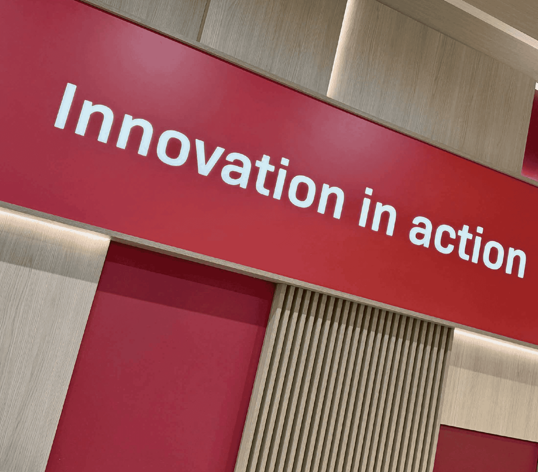 The words innovation in action on a red banner