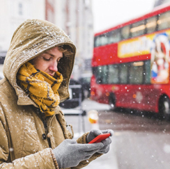 Person with phone in the snow