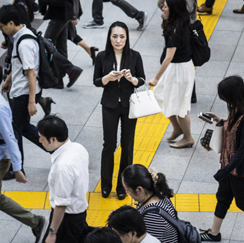 Woman standing on yellow arrow