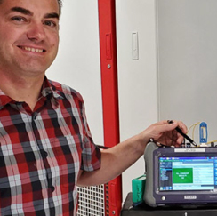 Jean Gregoire, Network Integrity Sr Design Specialist at TELUS, standing in front of the WL5e equipment being tested in Quebec City.