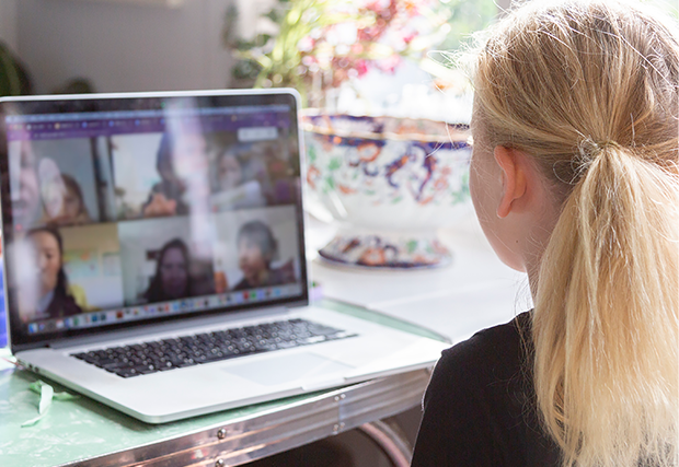 a girl in front of a laptop