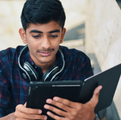 Man with headphones on tablet