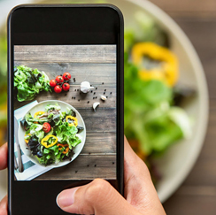 iPhone taking a photo of salad