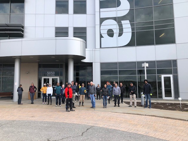 a group of people in front of a ciena office