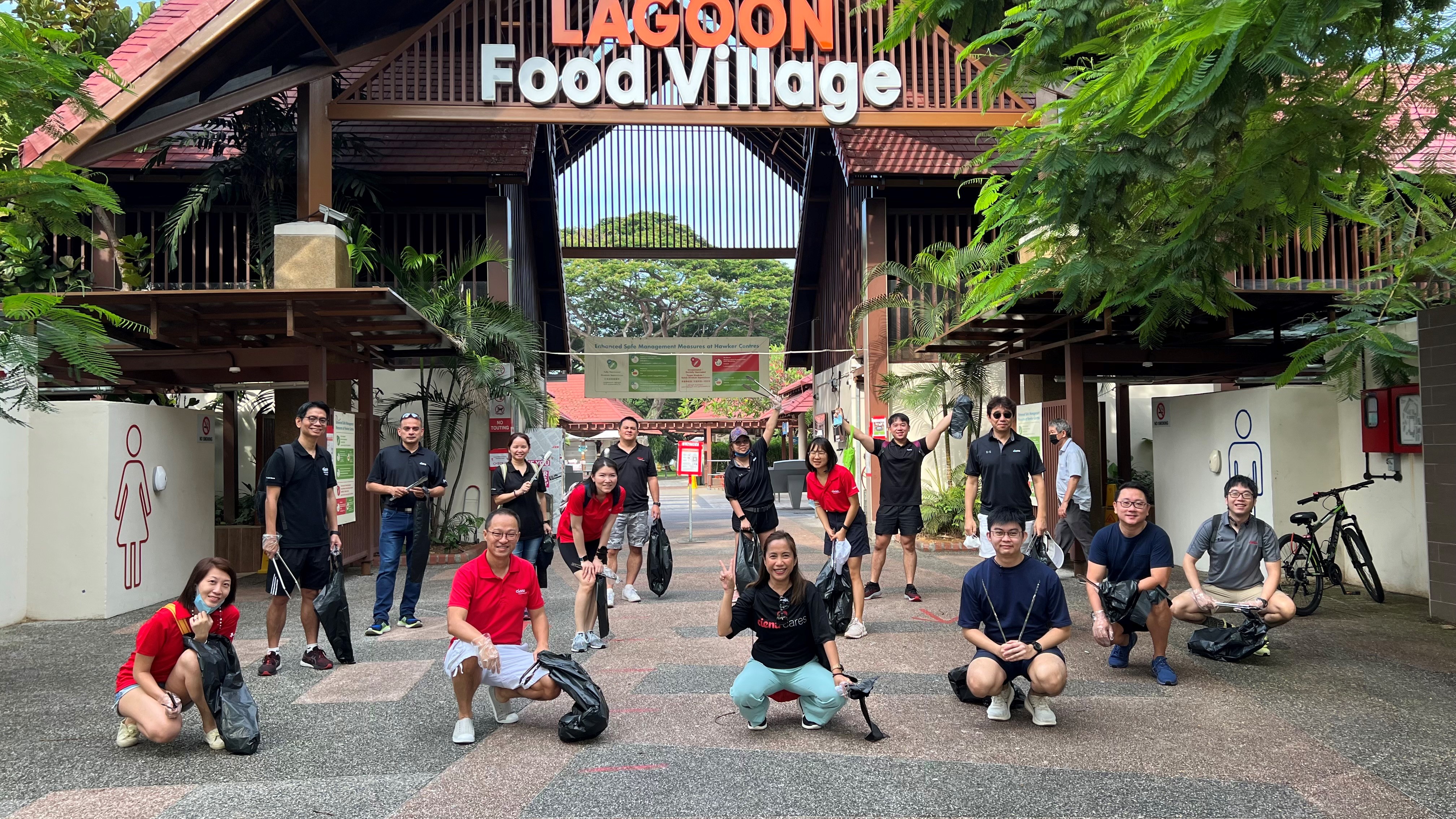 people in front of a sign that says lagoon food village