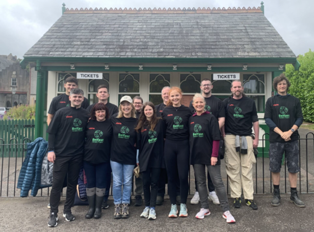 The team standing as a group at a tree planting event