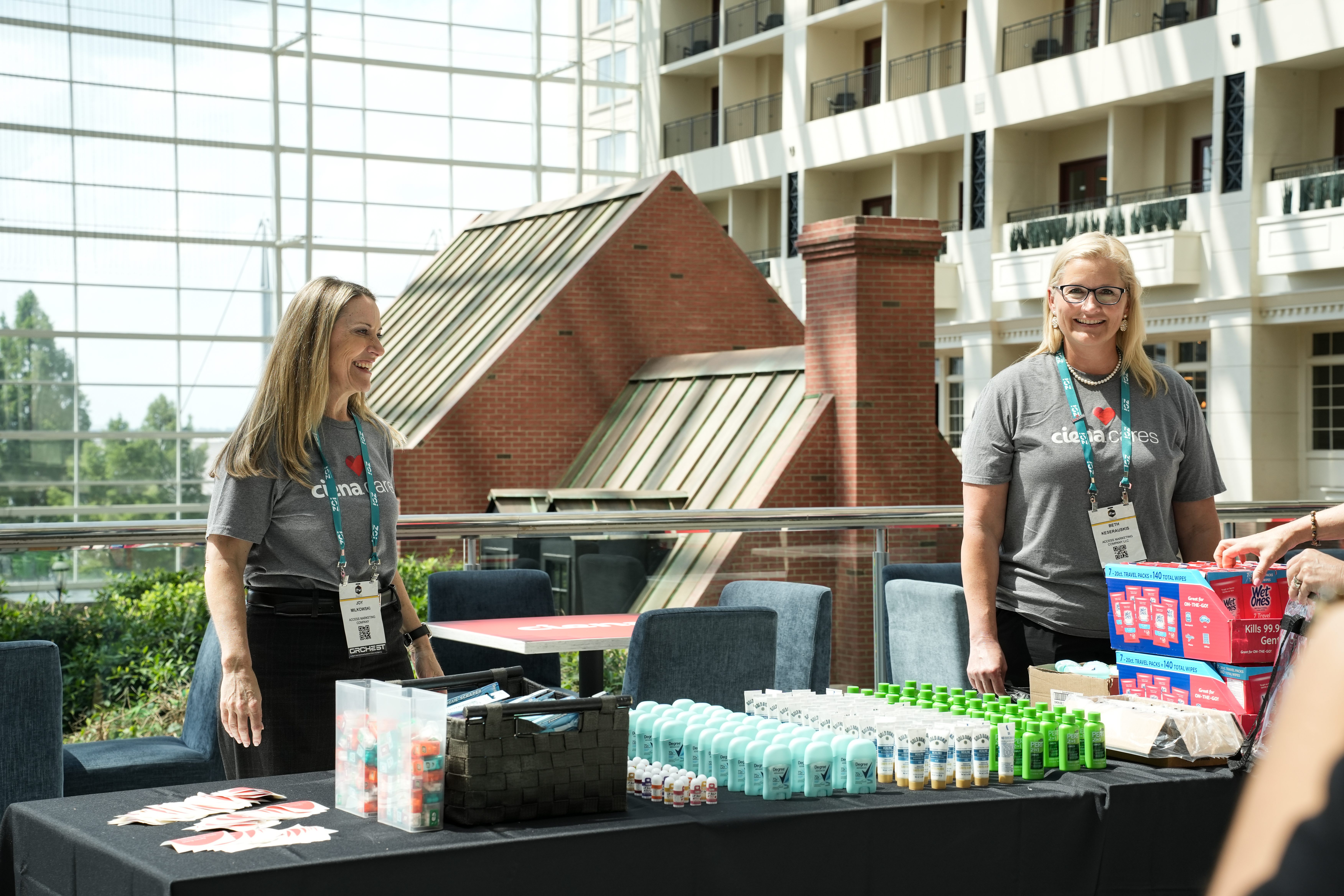 Ciena Cares volunteers organizing donated personal-care items at a charity event.