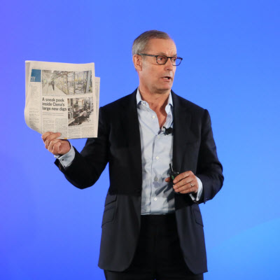 Gary Smith holding newspaper