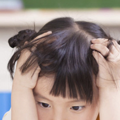 Girl with hands on head