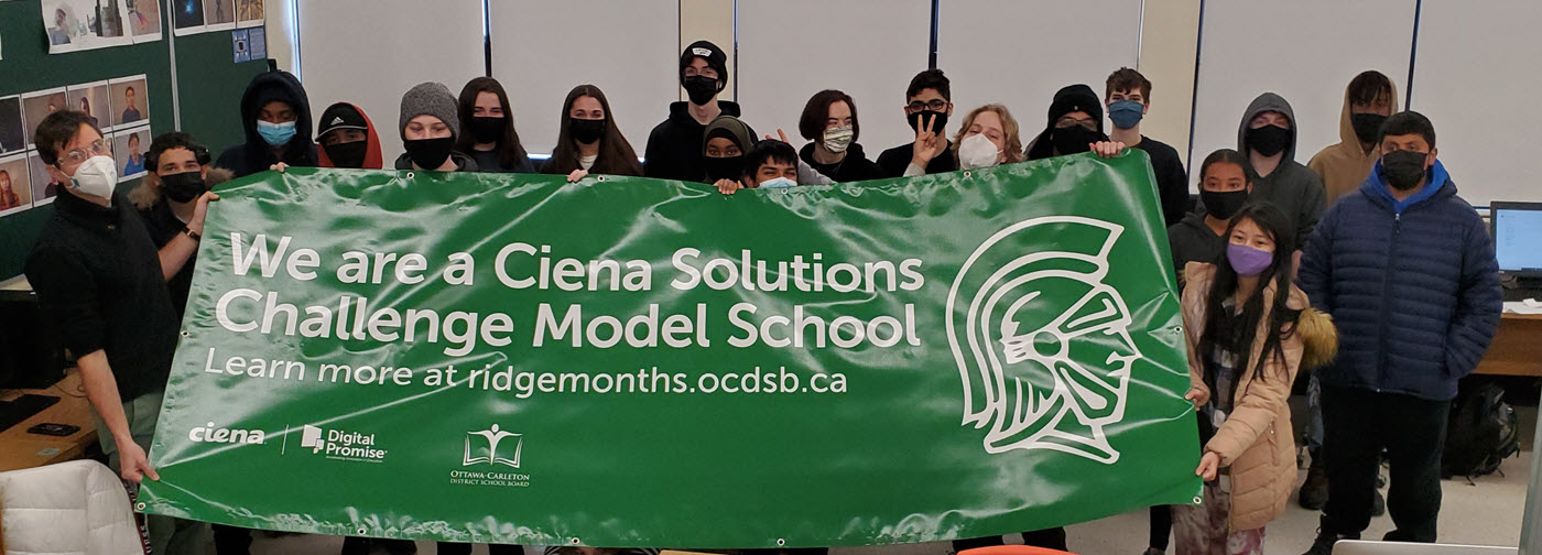 Ridgemont students holding the Ciena Solutions Challenge Model School banner