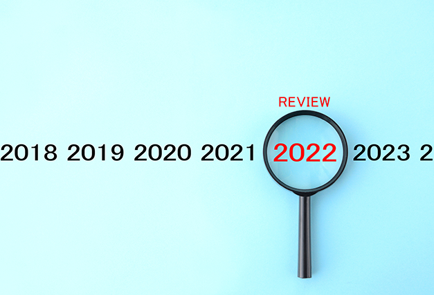 years 2020 through 2023 listed on a blue background with a magnifying glass over 2022