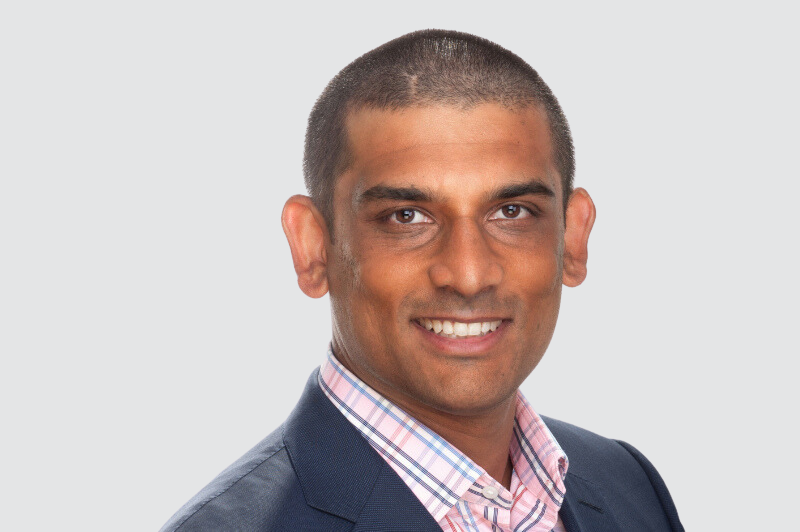 headshot of a man smiling 