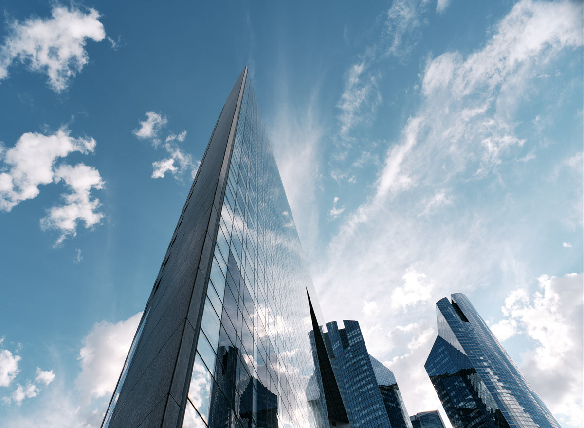 Skyscrapers against blue sky and white clouds