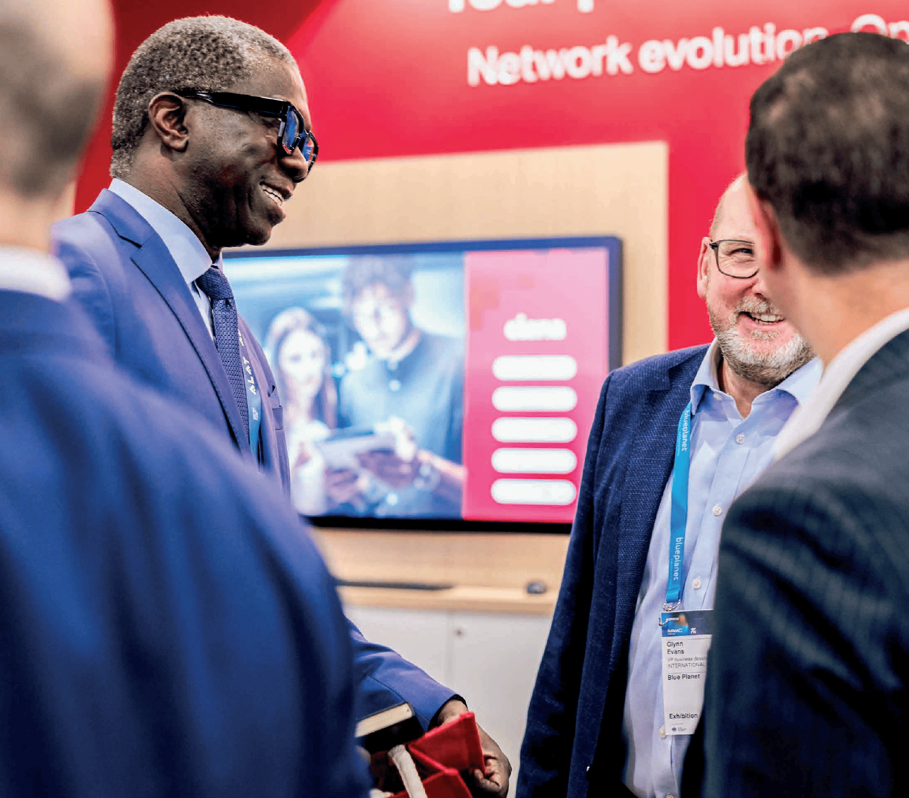 men talking at the Mobile World Congress event