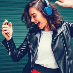 Girl with blue headphones on dancing 