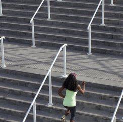 Woman jogging up stairs