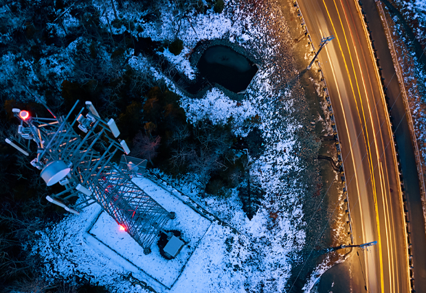 a cell tower along side a road