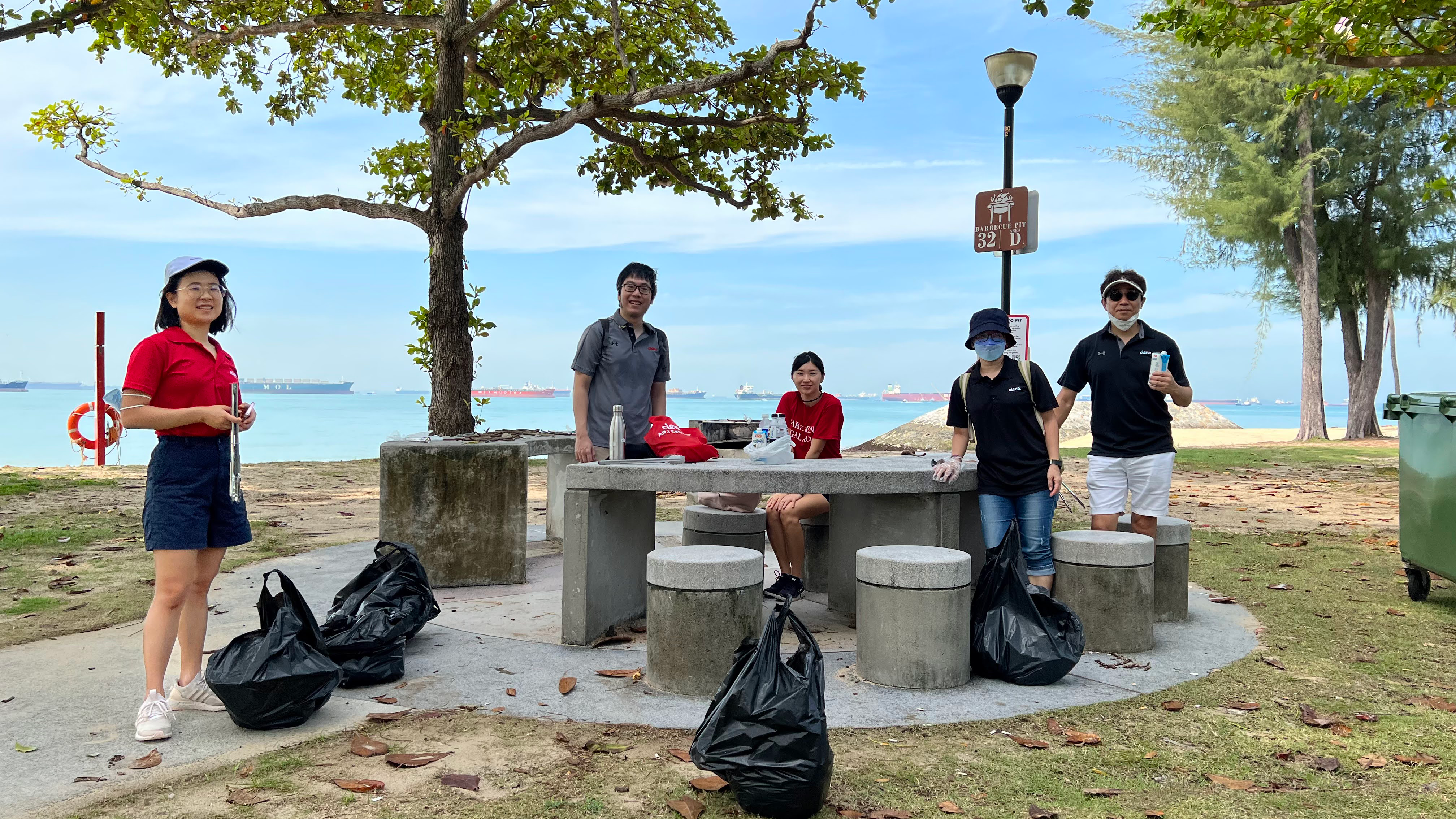 a group of ciena employees cleaning east coast park