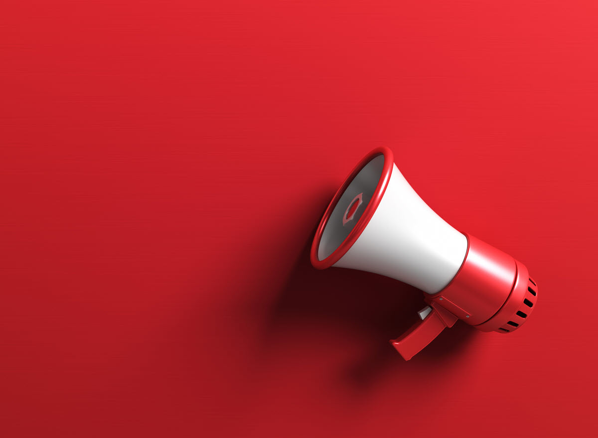 White megaphone on red background