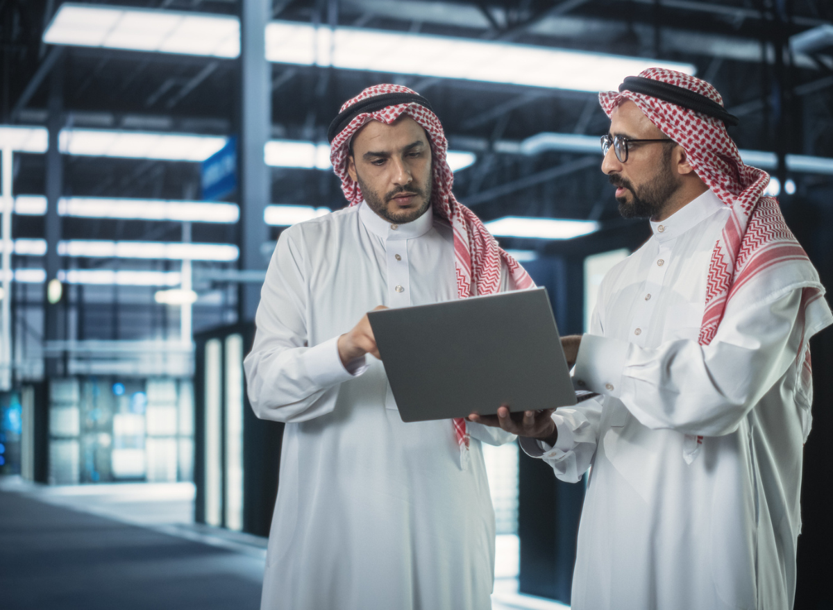 Two men on laptops