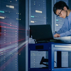 Man with glasses, streaks come from laptop