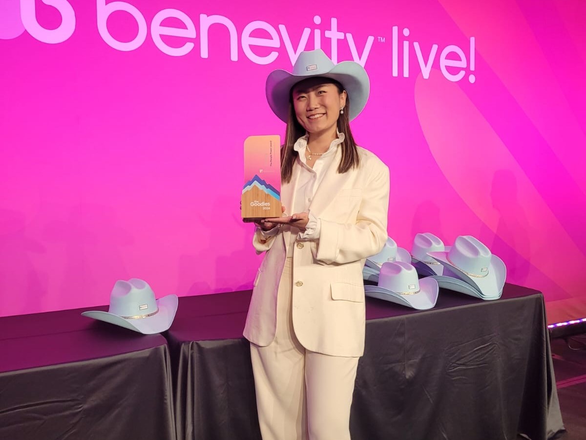 Employee holding an award