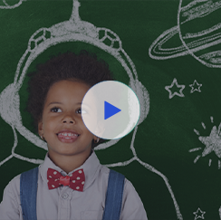 Young student in front of chalk board