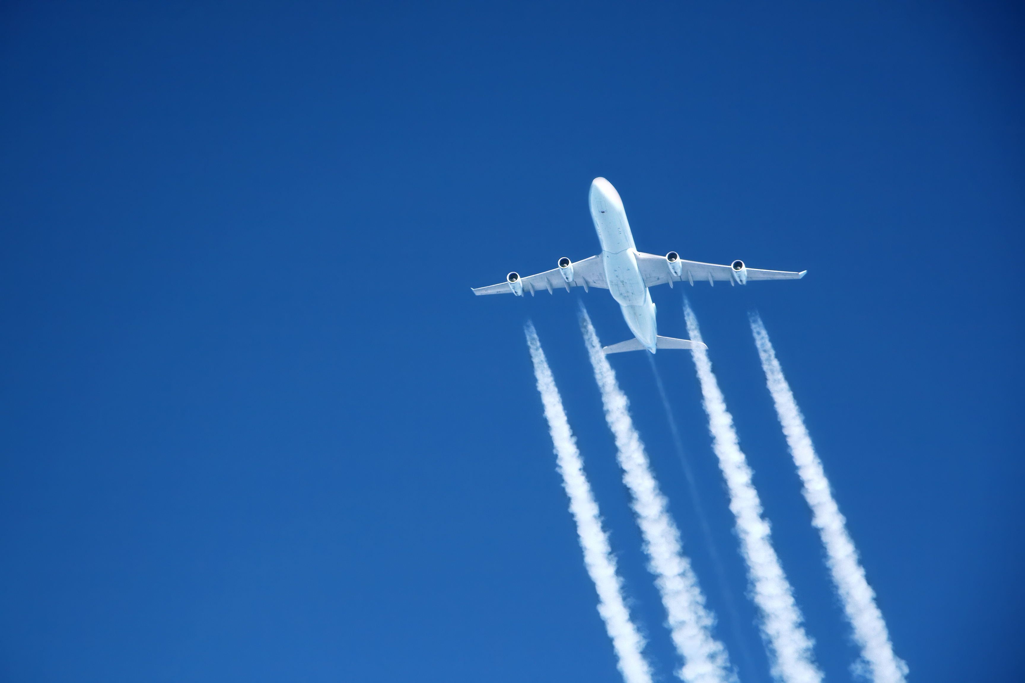 Aircraft flying in blue sky