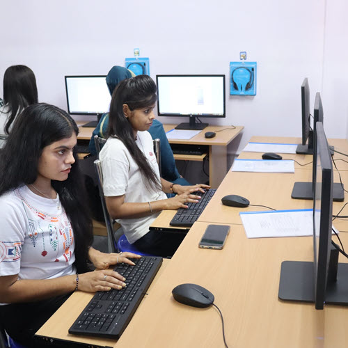 Ladies in India participating in a digital skills training session.